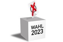 eine Wahlurne mit dem Text Wahl 2023 und einem großen roten Kreuz auf einem Zettel