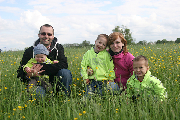 A young family in a field