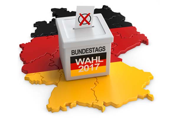 den Umriss von Deutschland in den Farben schwarz, rot und gelb, auf dem eine Wahlurne steht