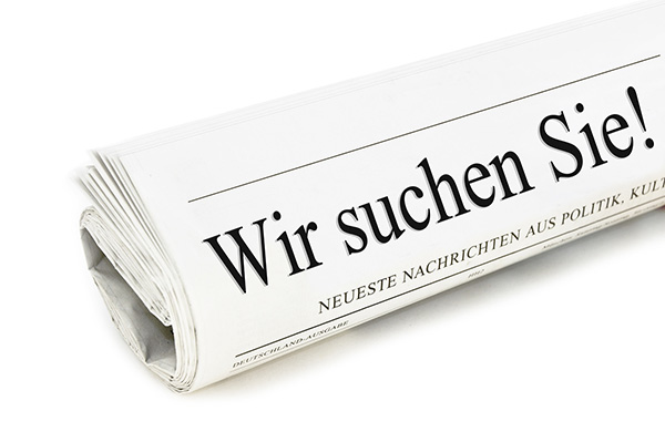 eine Zeitung mit der Aufschrift Wir suchen Sie!