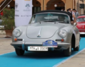 Grauses Cabriolet, mit verschlossenem Verdeck, fährt auf einem blauen Teppich | Copyright: Teilnehmer Grauses Cabriolet, mit verschlossenem Verdeck, fährt auf einem blauen Teppich